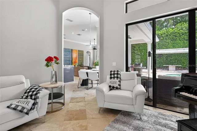 a dining room with furniture and window