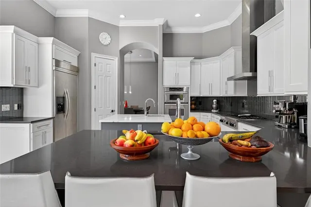 a car parked in front of a house with a yard