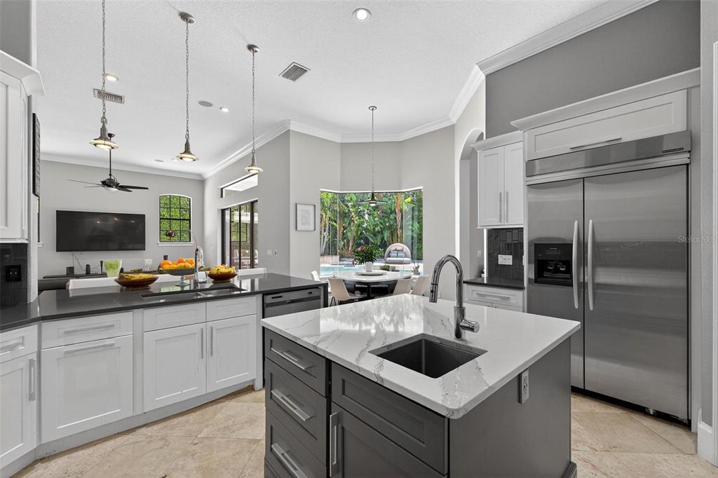 11015 Hawkshead Court Windermere, FL 34786 - Photo 54 of 90 a kitchen with a sink a counter top space appliances and cabinets