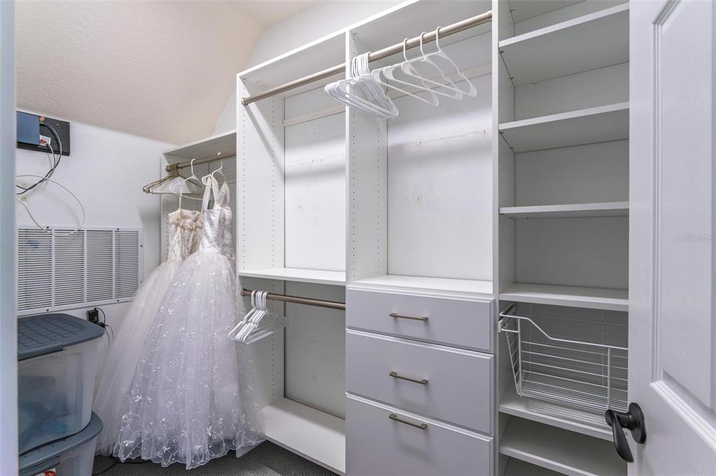 11015 Hawkshead Court Windermere, FL 34786 - Photo 78 of 90 a view of walk in closet with clothes and shoes