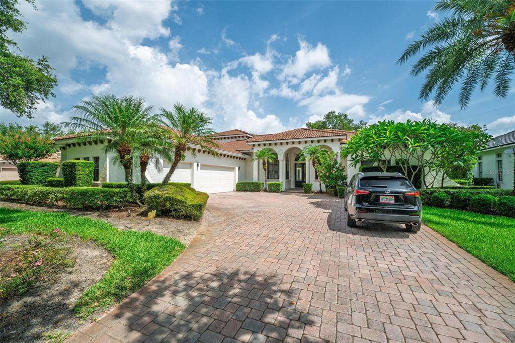 11015 Hawkshead Court Windermere, FL 34786 - Photo 90 of 90 a car parked in front of a house with a yard