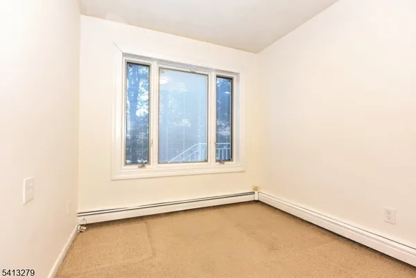 a bathroom with a sink mirror toilet and shower