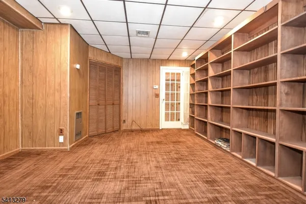 a utility room with cabinets washer and dryer