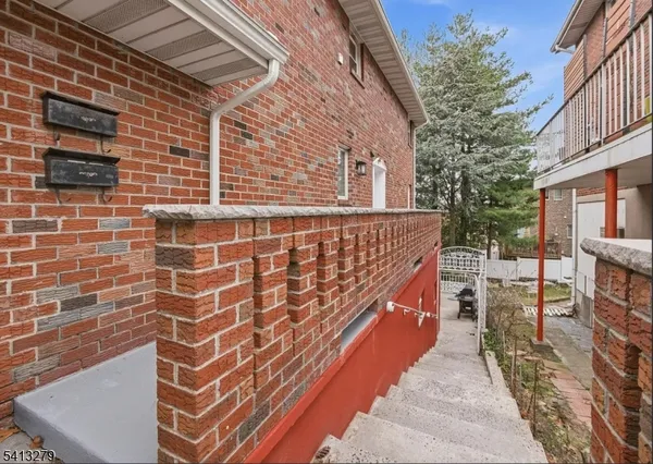 a view of a patio with a table and chairs