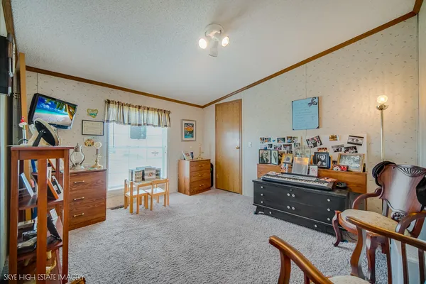 a room with furniture and a flat screen tv