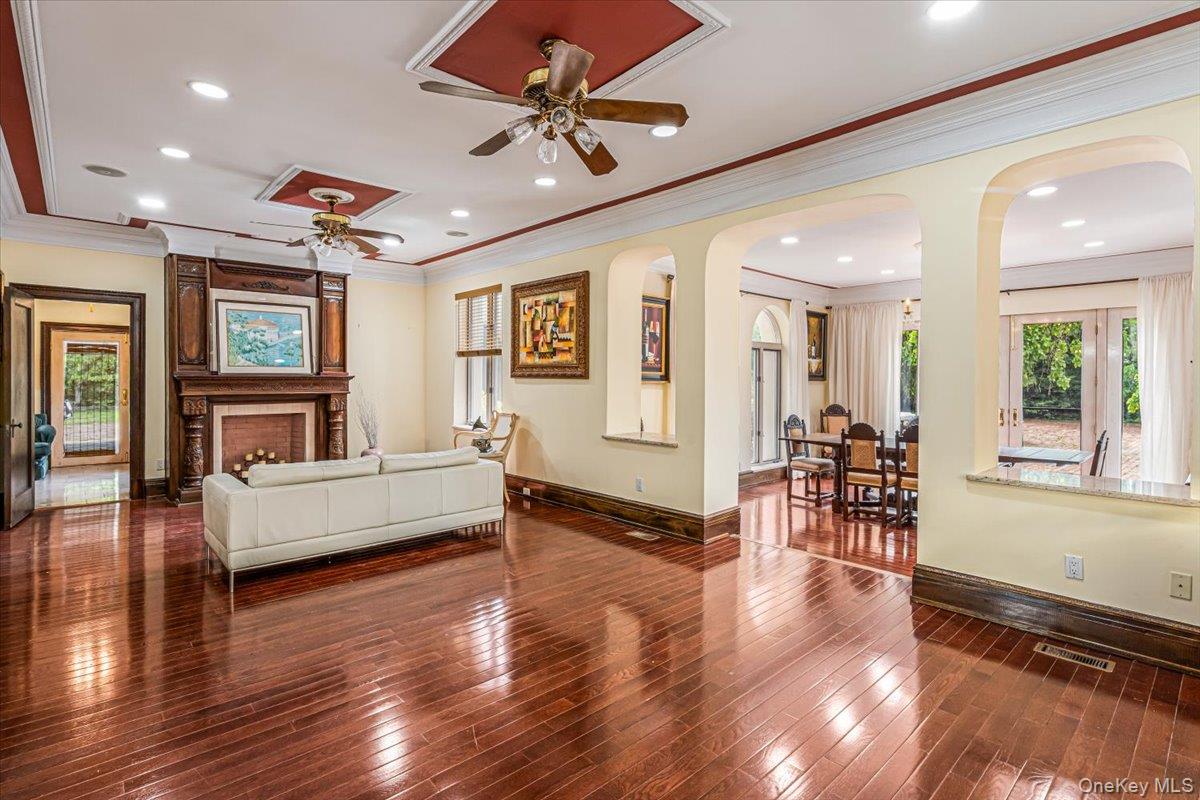 952 Cedar Swamp Road Glen Head, NY 11545 - Photo 14 of 50 a living room with furniture and a wooden floor