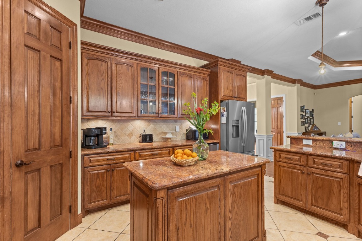 5535 Bearfoot Road Orange, TX 77632 - Photo 13 of 50 a kitchen with a sink refrigerator and cabinets