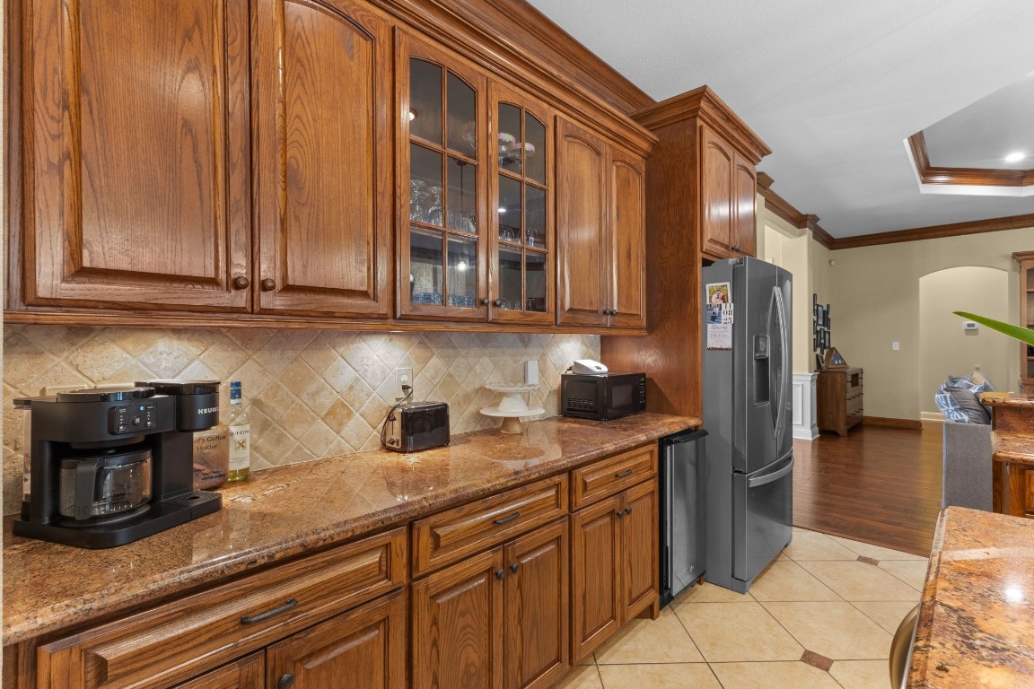 5535 Bearfoot Road Orange, TX 77632 - Photo 17 of 50 a kitchen with stainless steel appliances granite countertop a sink and cabinets