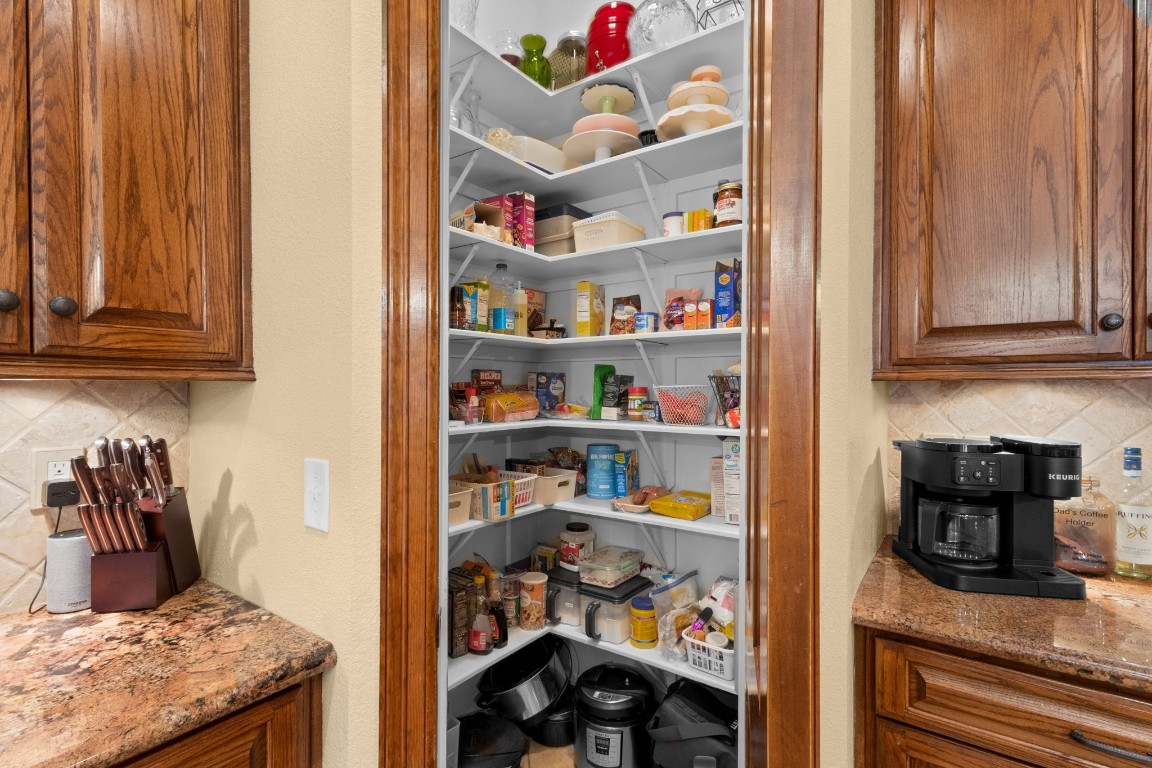 5535 Bearfoot Road Orange, TX 77632 - Photo 19 of 50 a kitchen with a refrigerator and cabinets