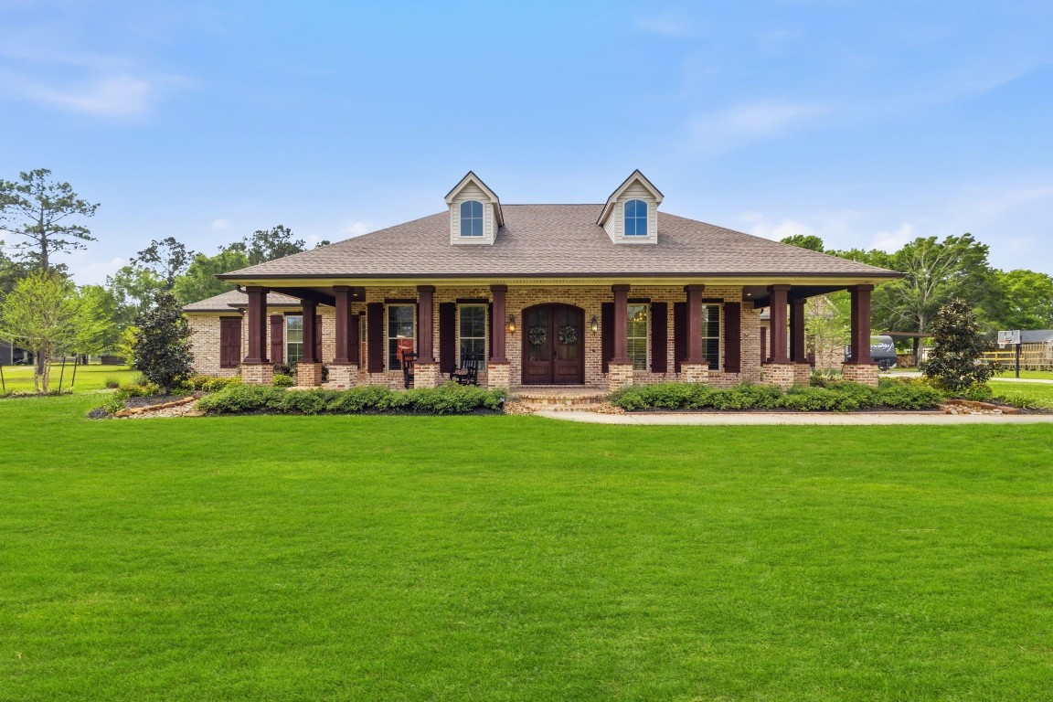 5535 Bearfoot Road Orange, TX 77632 - Photo 2 of 50 a front view of a house with a garden
