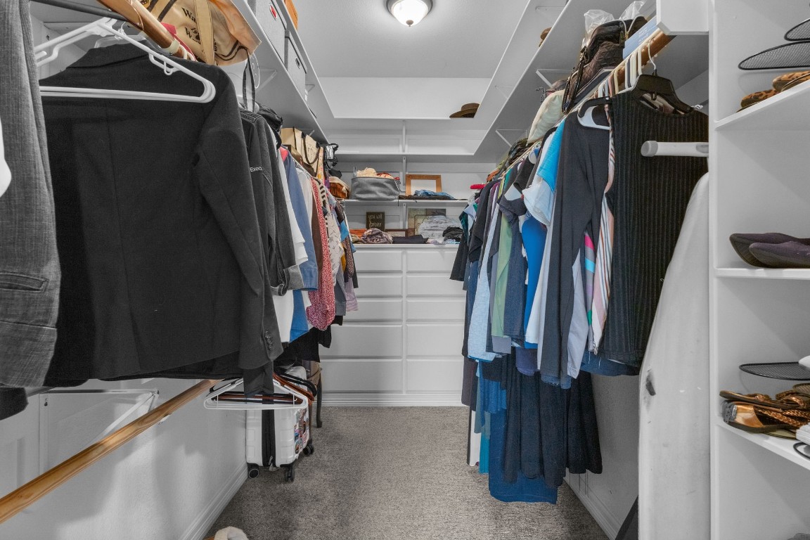 5535 Bearfoot Road Orange, TX 77632 - Photo 25 of 50 a view of walk in closet with clothes and shoes