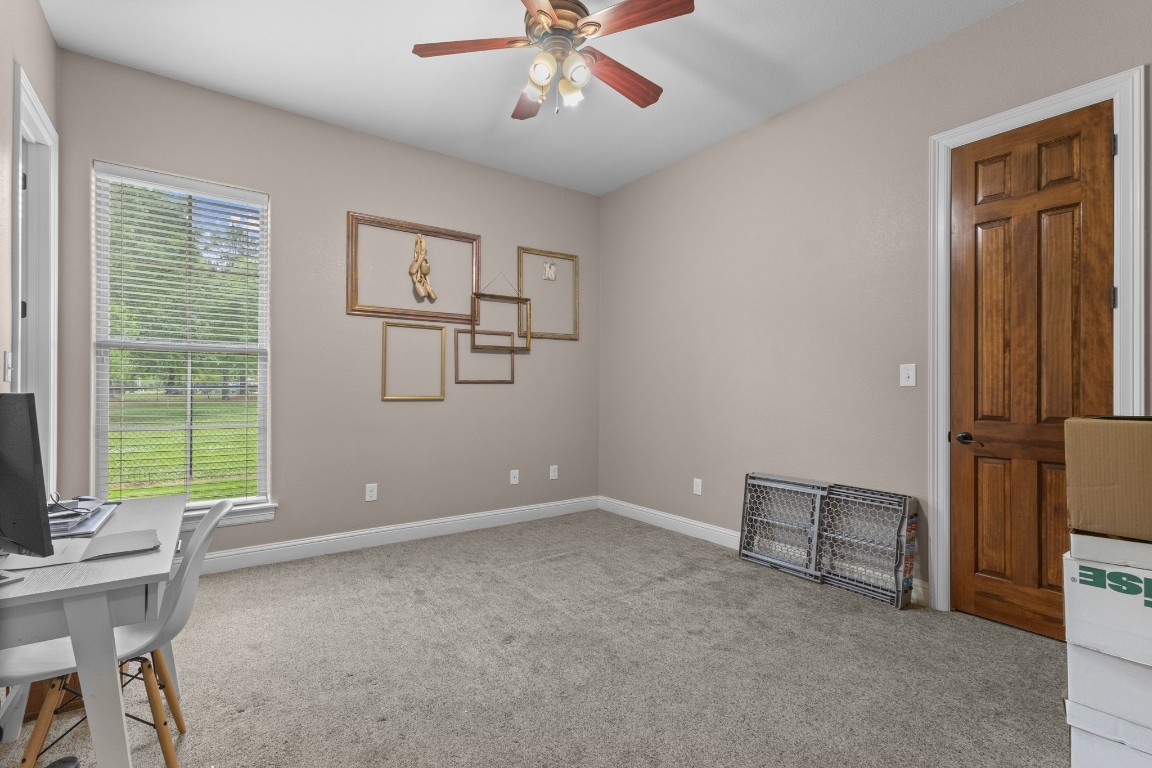 5535 Bearfoot Road Orange, TX 77632 - Photo 33 of 50 a view of room with window ceiling fan and hardwood floor