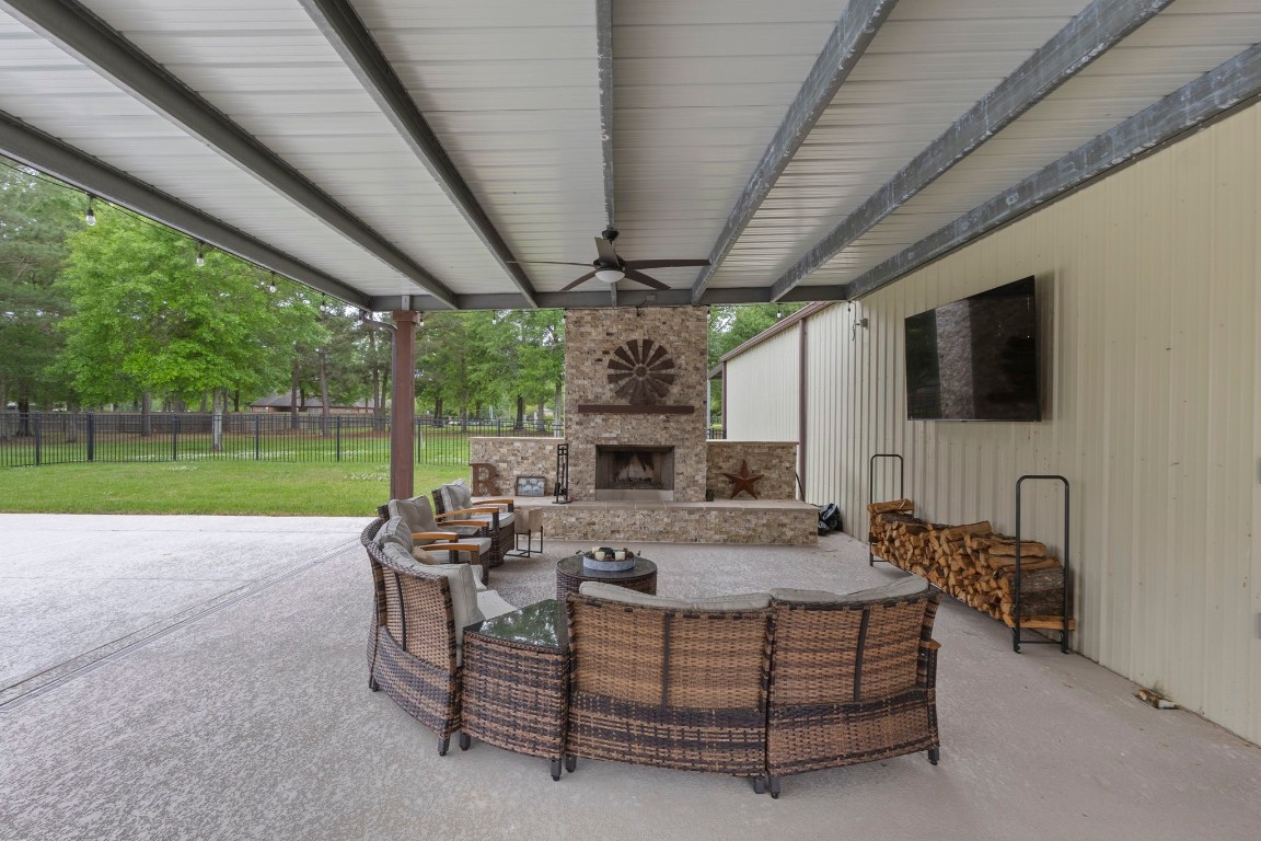 5535 Bearfoot Road Orange, TX 77632 - Photo 40 of 50 a view of a patio with table and chairs potted plants with wooden floor and fence