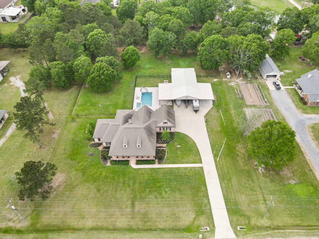 5535 Bearfoot Road Orange, TX 77632 - Photo 46 of 50 a view of a house with a yard