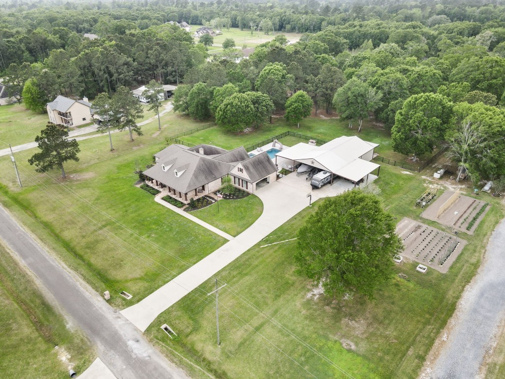 5535 Bearfoot Road Orange, TX 77632 - Photo 47 of 50 an aerial view of a house with a yard