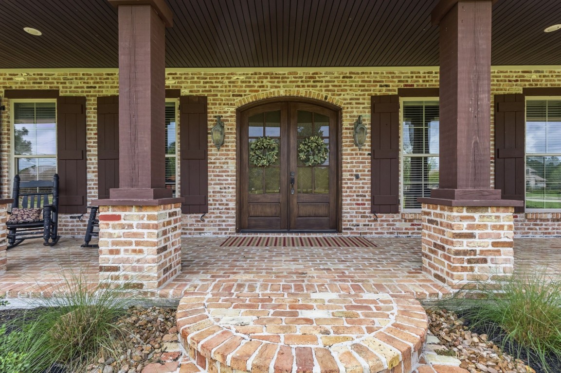5535 Bearfoot Road Orange, TX 77632 - Photo 5 of 50 front view of a brick house with a outdoor space
