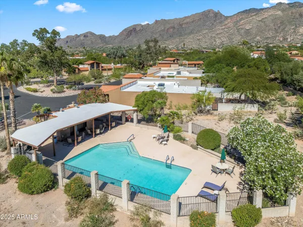 an aerial view of residential houses and outdoor space