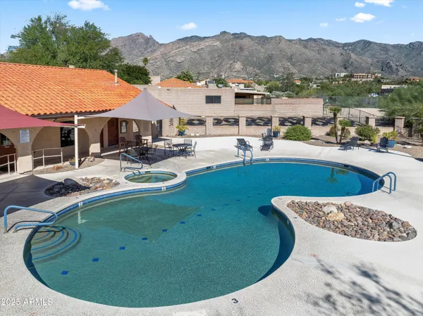 a view of a swimming pool with a patio