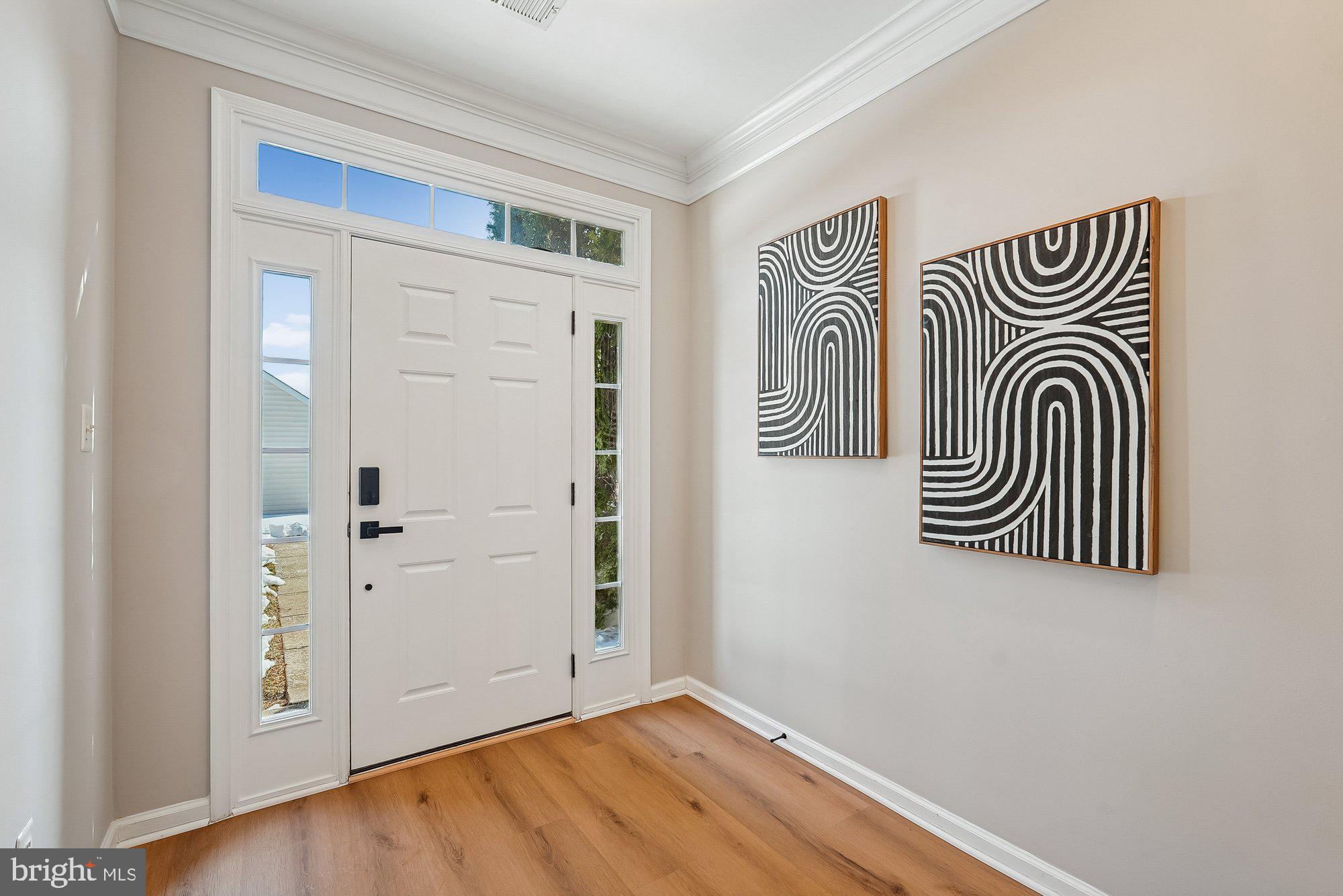 22982 Fox Fire Terrace Brambleton, VA 20148 - Photo 11 of 50 an entryway with wooden floor