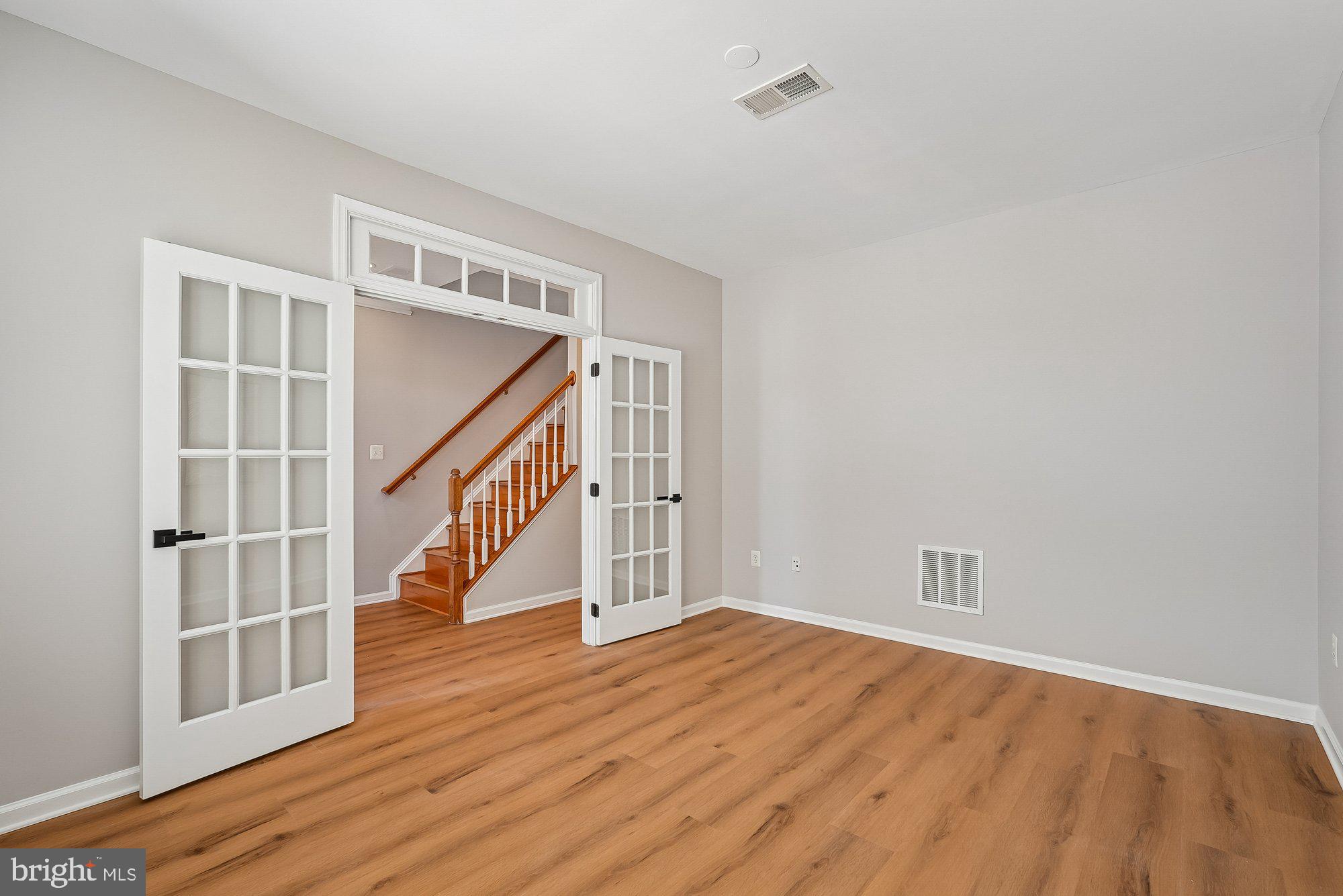 22982 Fox Fire Terrace Brambleton, VA 20148 - Photo 15 of 50 a view of entryway with wooden floor and stairs