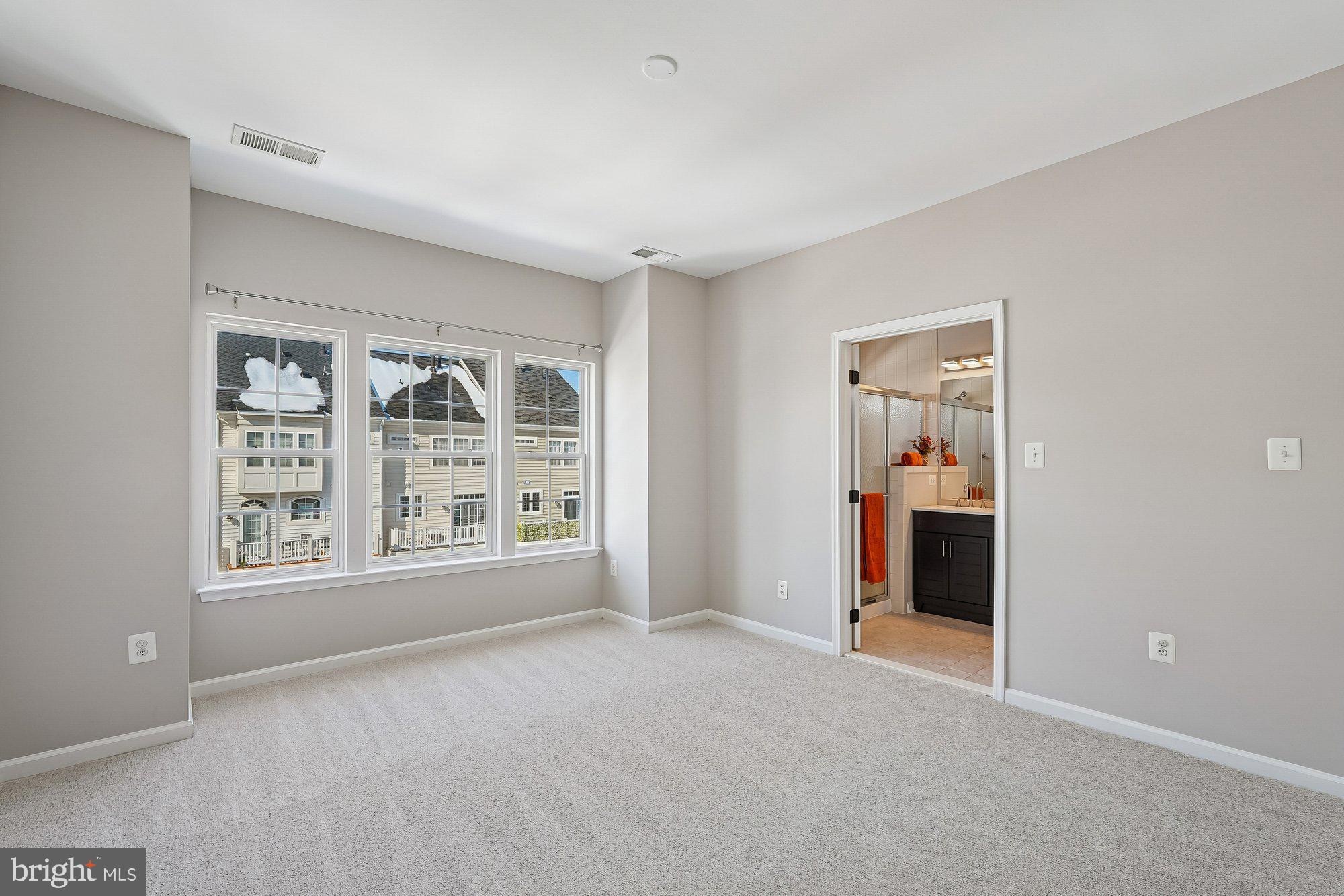 22982 Fox Fire Terrace Brambleton, VA 20148 - Photo 29 of 50 an empty room with windows and closet