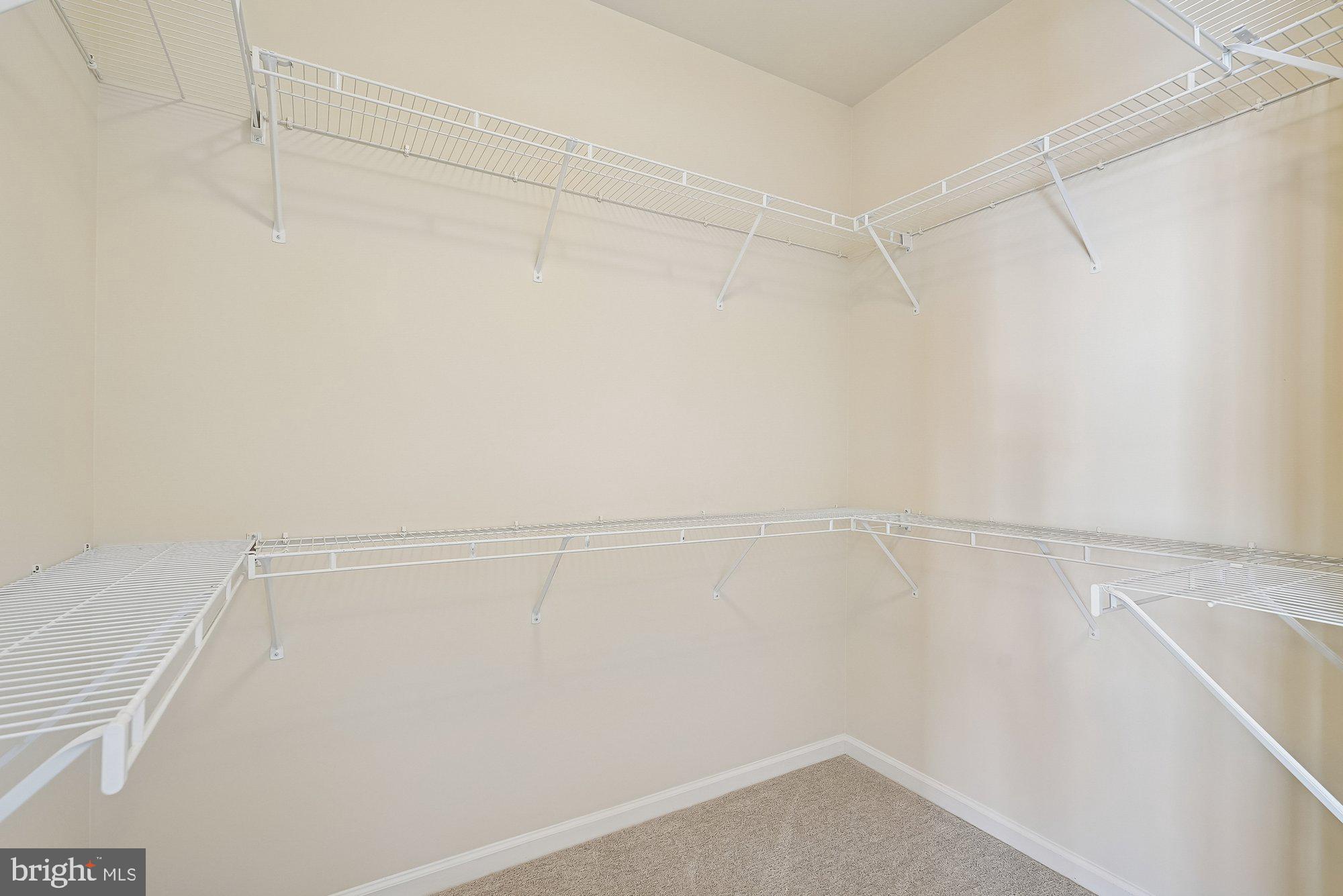 22982 Fox Fire Terrace Brambleton, VA 20148 - Photo 32 of 50 a view of a room with racks on the wall