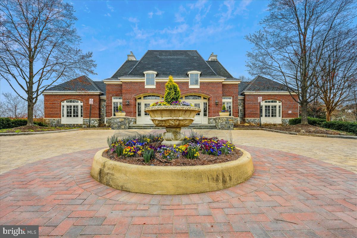 22982 Fox Fire Terrace Brambleton, VA 20148 - Photo 46 of 50 a view of a house with a fire pit and a yard