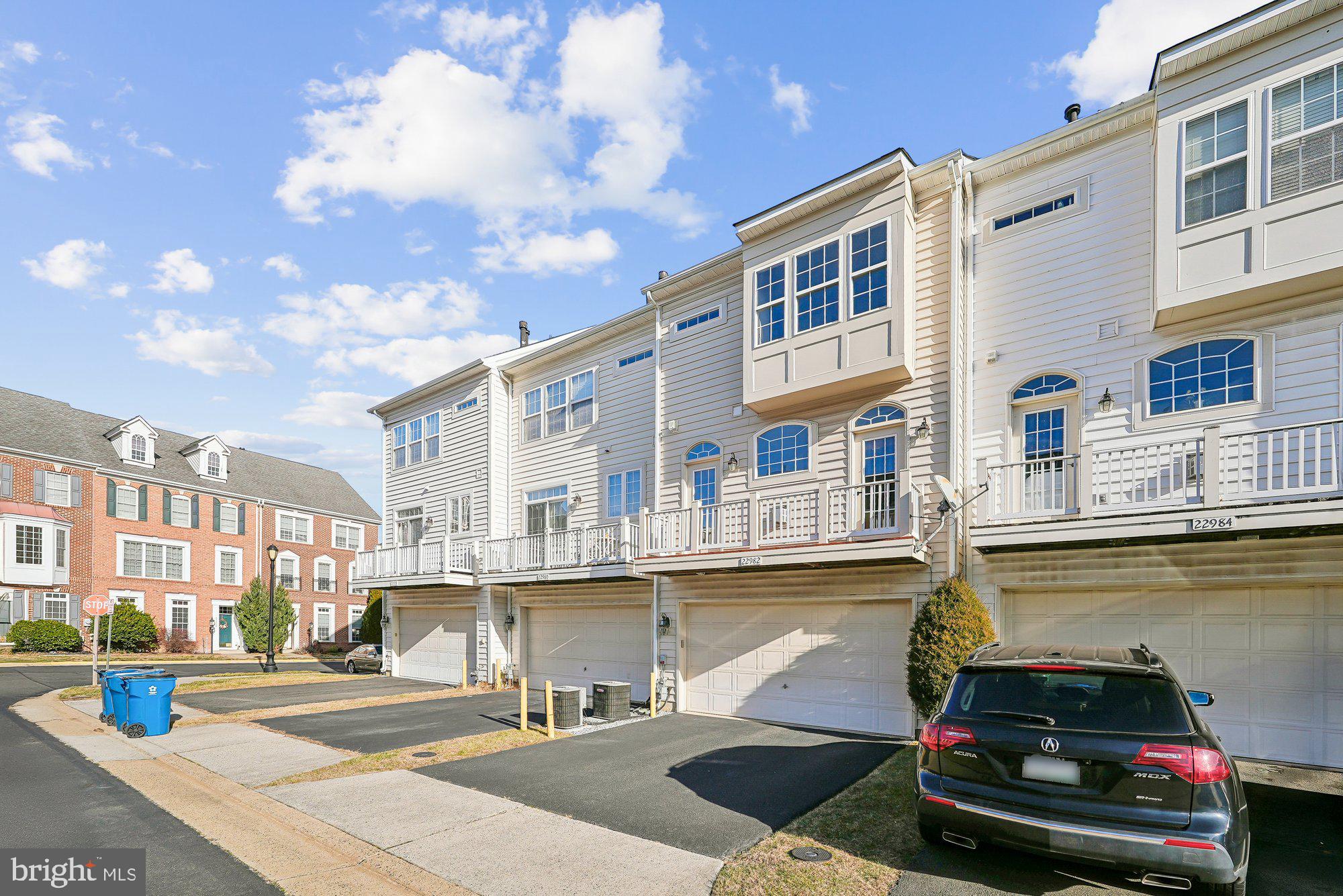 22982 Fox Fire Terrace Brambleton, VA 20148 - Photo 7 of 50 a car parked in front of a building