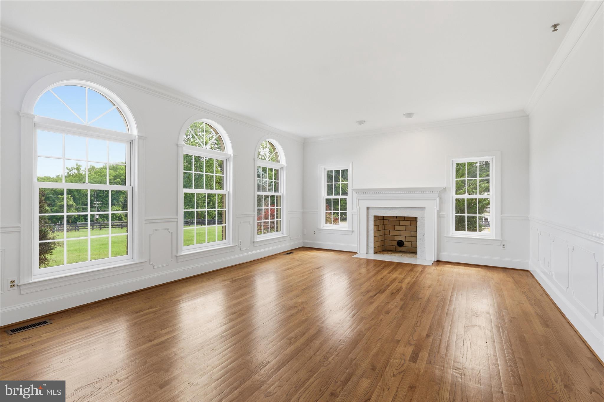 1051 Kelso Road Great Falls, VA 22066 - Photo 4 of 40 Sun-filled living room with cozy fireplace