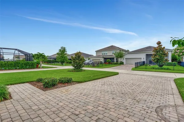 a view of a house with a yard and plants