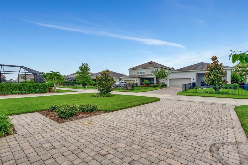 11616 Golden Bay Place Lakewood Ranch, FL 34211 - Photo 2 of 66 a view of a house with a yard and plants