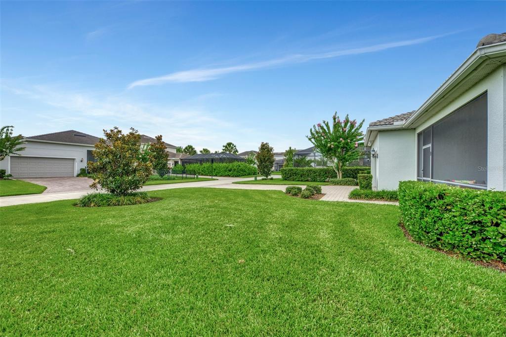 11616 Golden Bay Place Lakewood Ranch, FL 34211 - Photo 3 of 66 a view of a house with a yard