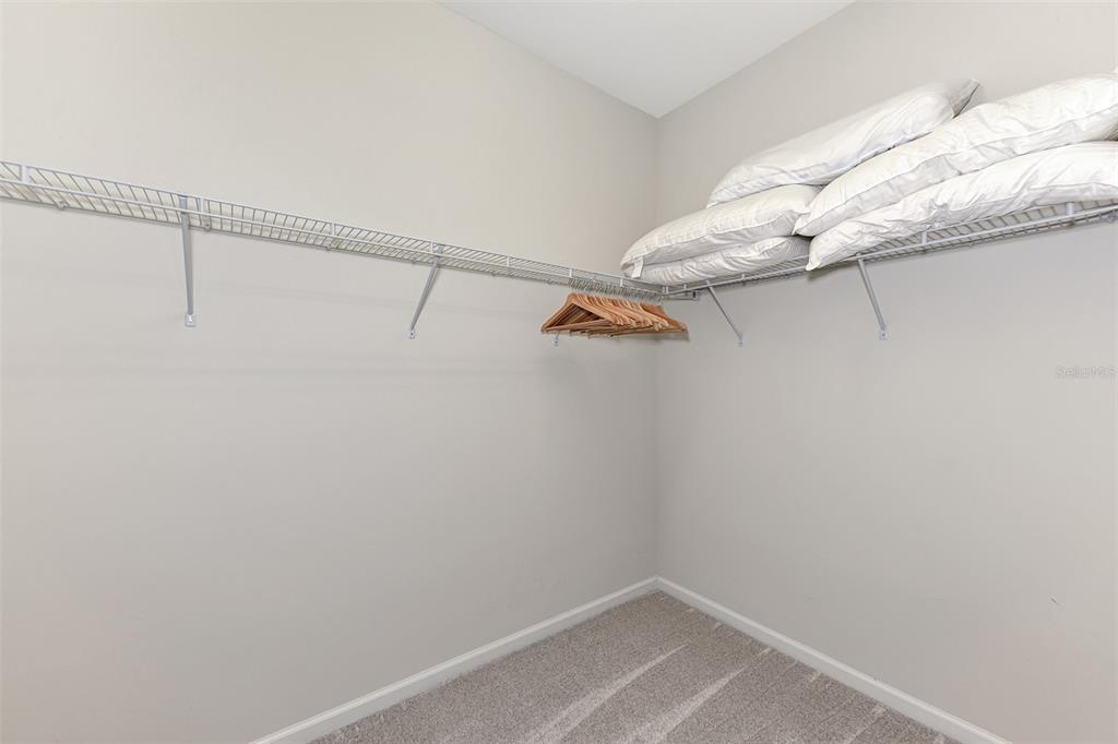 11616 Golden Bay Place Lakewood Ranch, FL 34211 - Photo 32 of 66 a view of a room with racks on the wall