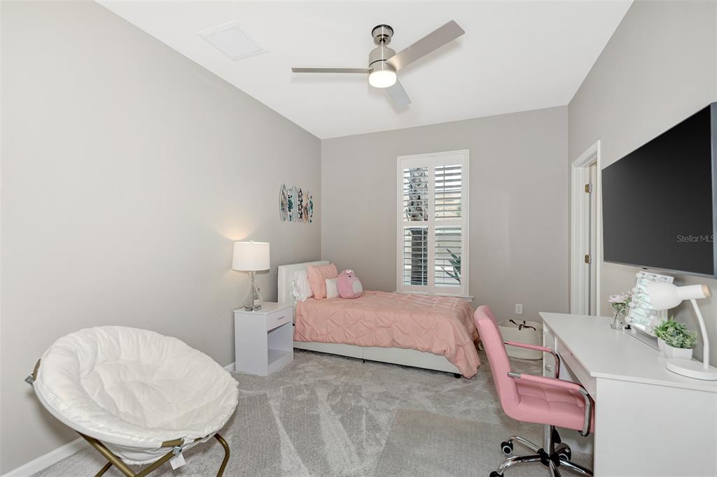 11616 Golden Bay Place Lakewood Ranch, FL 34211 - Photo 36 of 66 a bedroom with a bed window and a chair