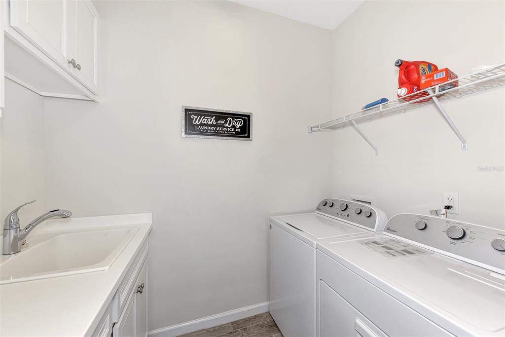 11616 Golden Bay Place Lakewood Ranch, FL 34211 - Photo 40 of 66 a utility room with dryer and washer