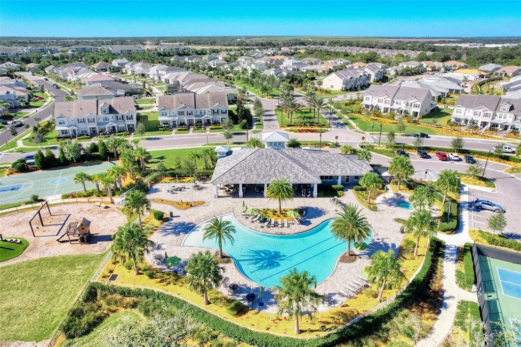 11616 Golden Bay Place Lakewood Ranch, FL 34211 - Photo 58 of 66 an aerial view of residential houses with outdoor space and swimming pool