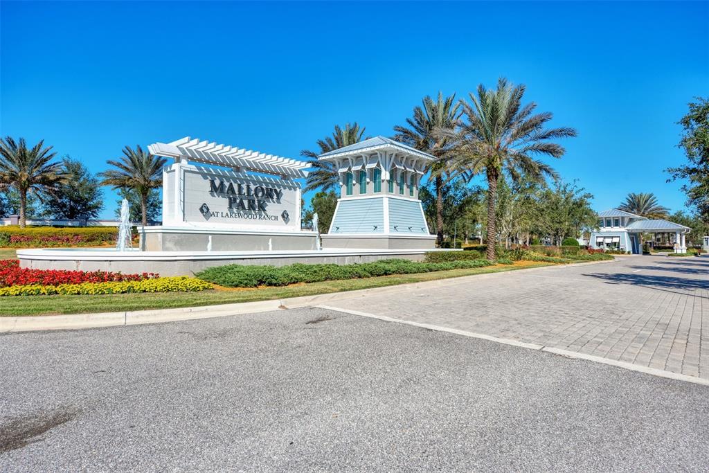 11616 Golden Bay Place Lakewood Ranch, FL 34211 - Photo 60 of 66 a front view of house with yard and outdoor seating