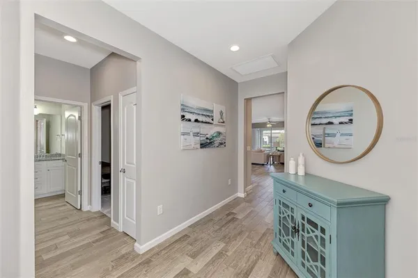 a large kitchen with a table and chairs