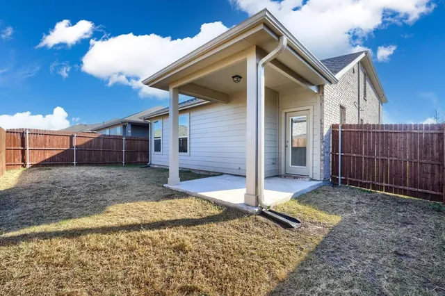 a backyard of a house with garden