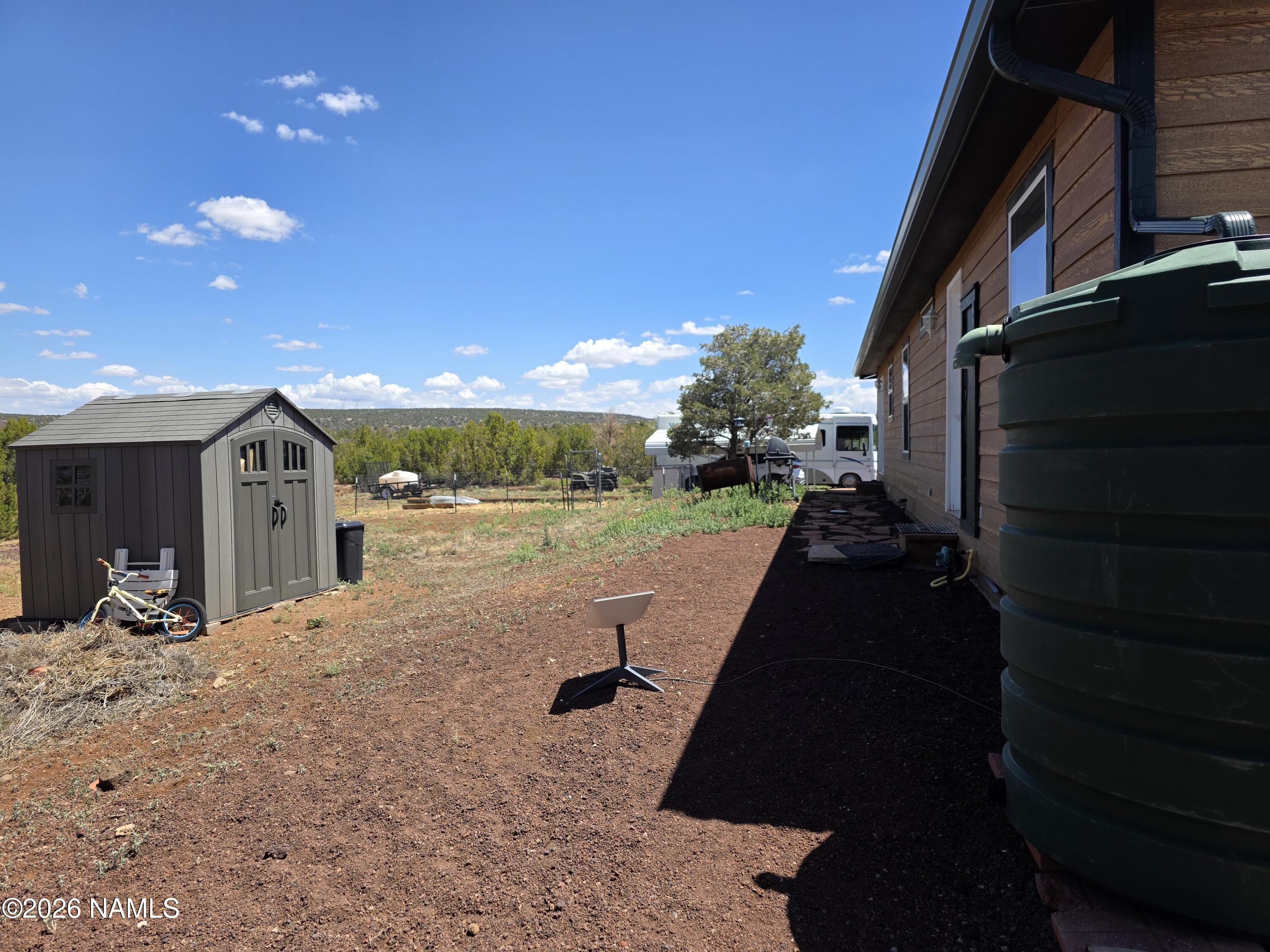 1431 East Cedar Road Williams, AZ 86046 - Photo 43 of 51 a view of a porch with furniture and a yard