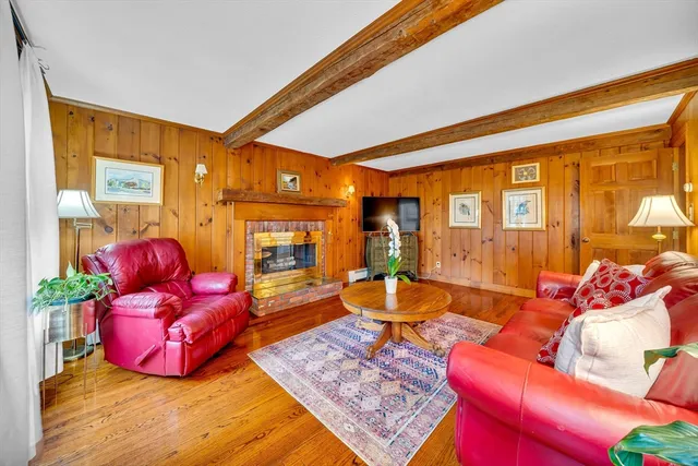 a living room filled with furniture and a large window