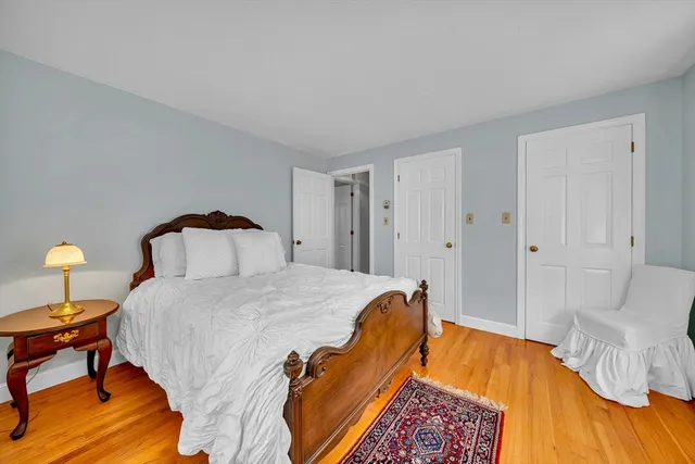 a bedroom with bed and a lamp