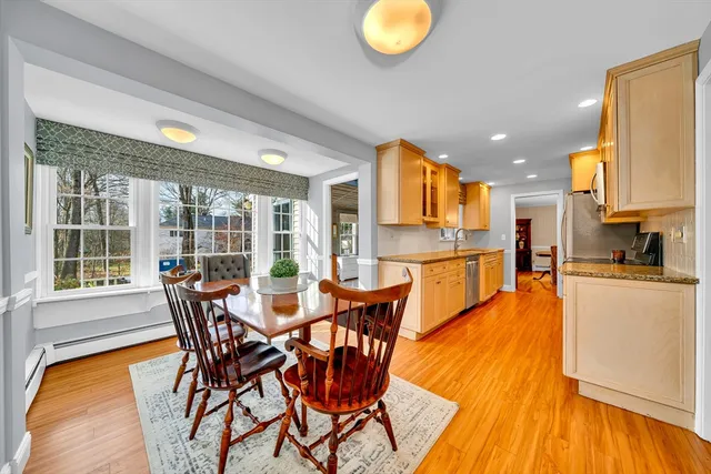 a view of a dining room with furniture and a wooden floor