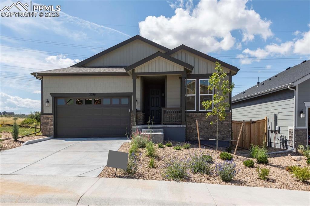a front view of a house with a garage
