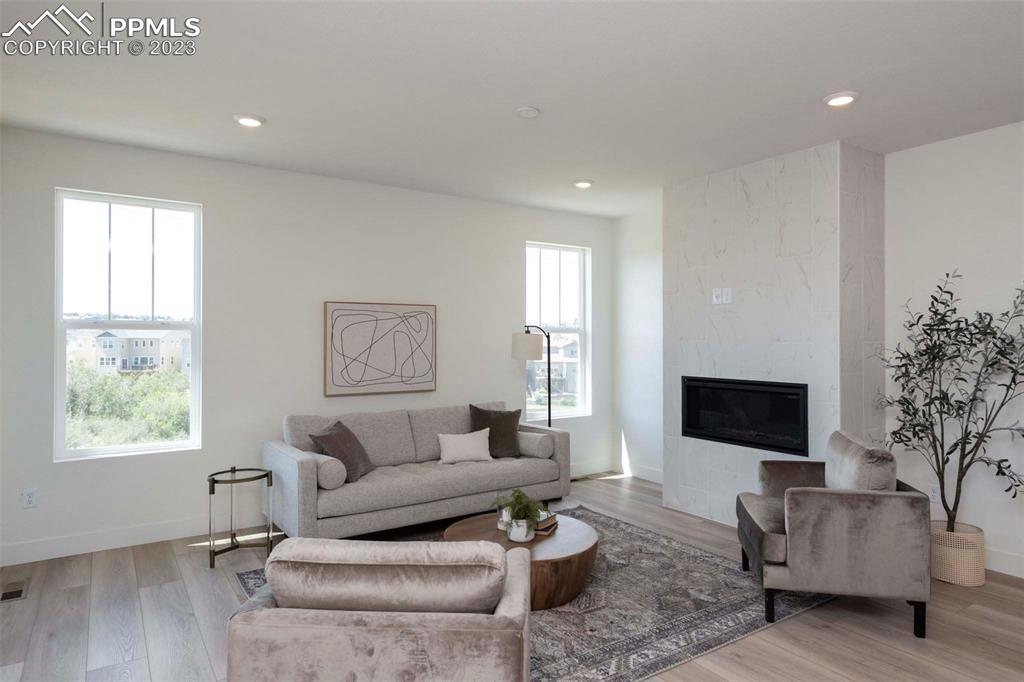 2036 Peachleaf Loop Castle Rock, CO 80108 - Photo 15 of 35 a living room with furniture and a flat screen tv