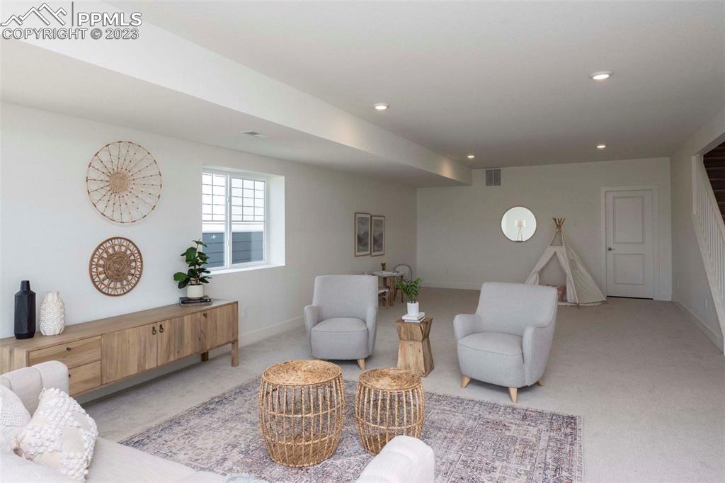 2036 Peachleaf Loop Castle Rock, CO 80108 - Photo 28 of 35 a living room with furniture and a window