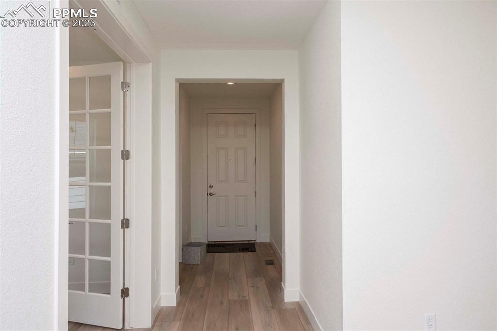2036 Peachleaf Loop Castle Rock, CO 80108 - Photo 3 of 35 a view of a bathroom from a hallway