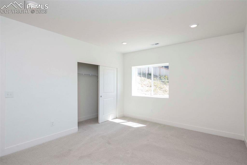 2036 Peachleaf Loop Castle Rock, CO 80108 - Photo 31 of 35 an empty room with windows