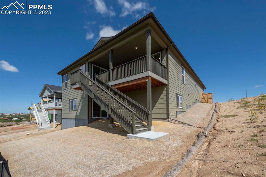 2036 Peachleaf Loop Castle Rock, CO 80108 - Photo 33 of 35 a front view of a house with a yard