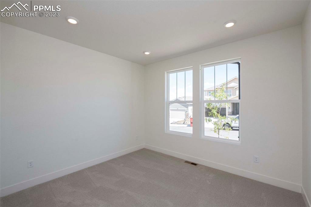 2036 Peachleaf Loop Castle Rock, CO 80108 - Photo 4 of 35 an empty room with windows